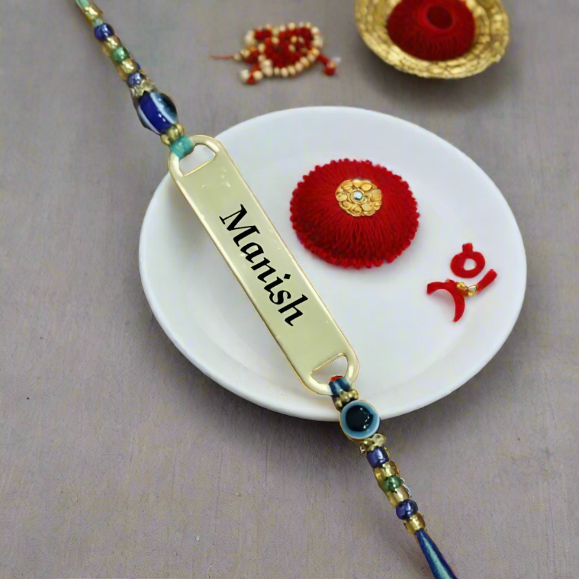 Show your love with a personalized Evil Eye Rakhi! Add your brother's name for a special touch.