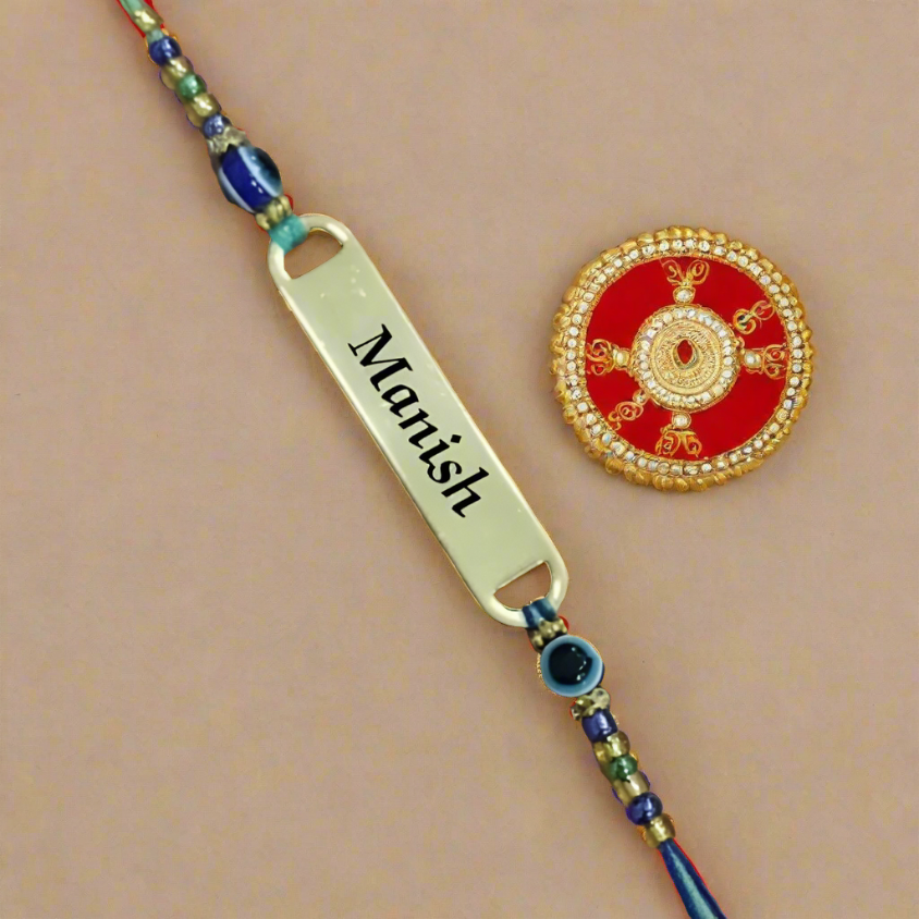 Close-up of Personalized Evil Eye Rakhi with "[Brother's Name]" clearly engraved. (Zestpics)