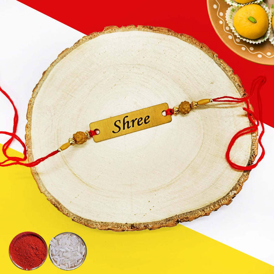 Personalized name metal rakhi is a unique and thoughtful gift for Raksha Bandhan. Made from high-quality metal, this rakhi features your loved one's name engraved in a beautiful font. Available in a variety of colors and styles, our metal rakhis are sure to find a place in your heart. Order yours today! Same Day Delivery of Personalised Rakhis in Hyderabad | Zestpics