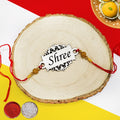 Personalized name silver designer acrylic rakhi is a unique and stylish gift for Raksha Bandhan. Made from high-quality silver acrylic, this rakhi features your loved one's name engraved in a beautiful font. Available in a variety of colors and styles, our silver designer acrylic rakhis are sure to make a lasting impression. Order yours today! Zestpics