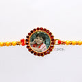 This Raksha Bandhan, Adorn His Wrist with a Fiery Bond: Personalized Red Stone Round Shape Photo Rakhi | Zestpics