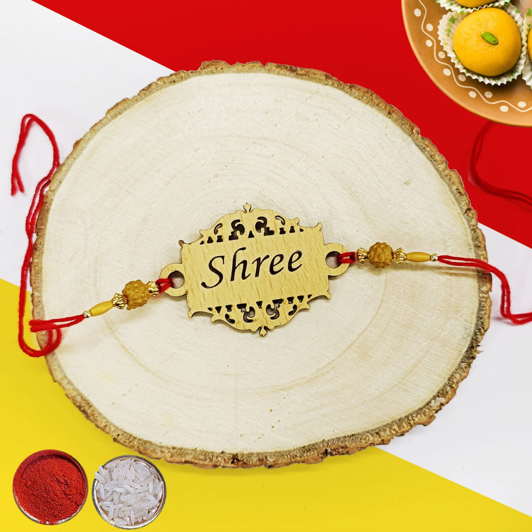 Personalized name wooden designer rakhi is a stylish and meaningful gift for Raksha Bandhan. Made from high-quality wood, this rakhi features your loved one's name engraved in a beautiful font. Available in a variety of colors and styles, our wooden designer rakhis are sure to become a cherished keepsake. Order yours today! Zestpics