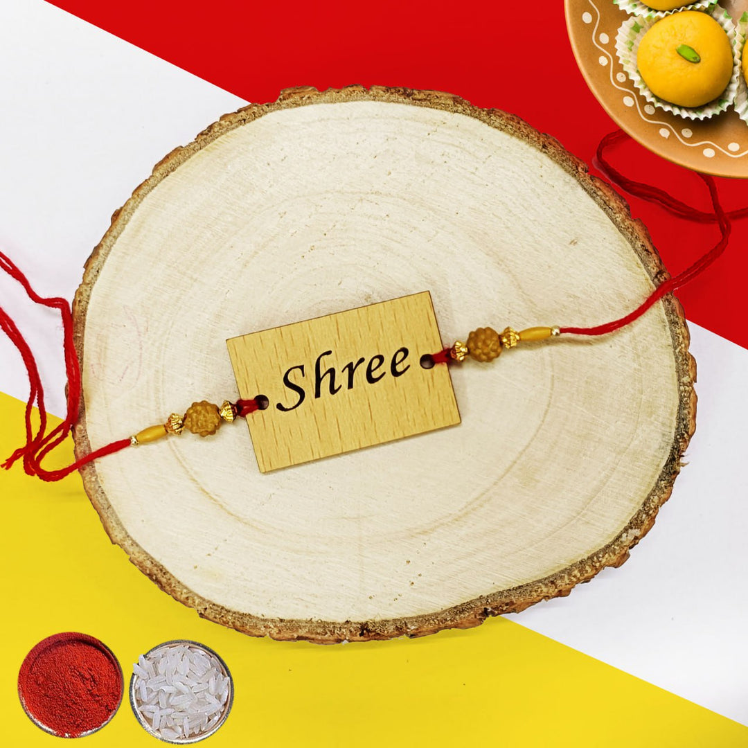 Personalized name wooden rakhi is a traditional and meaningful gift for Raksha Bandhan. Made from high-quality wood, this rakhi features your loved one's name engraved in a beautiful font. Available in a variety of colors and styles, our wooden rakhis are sure to become a cherished heirloom. Order yours today! Zestpics