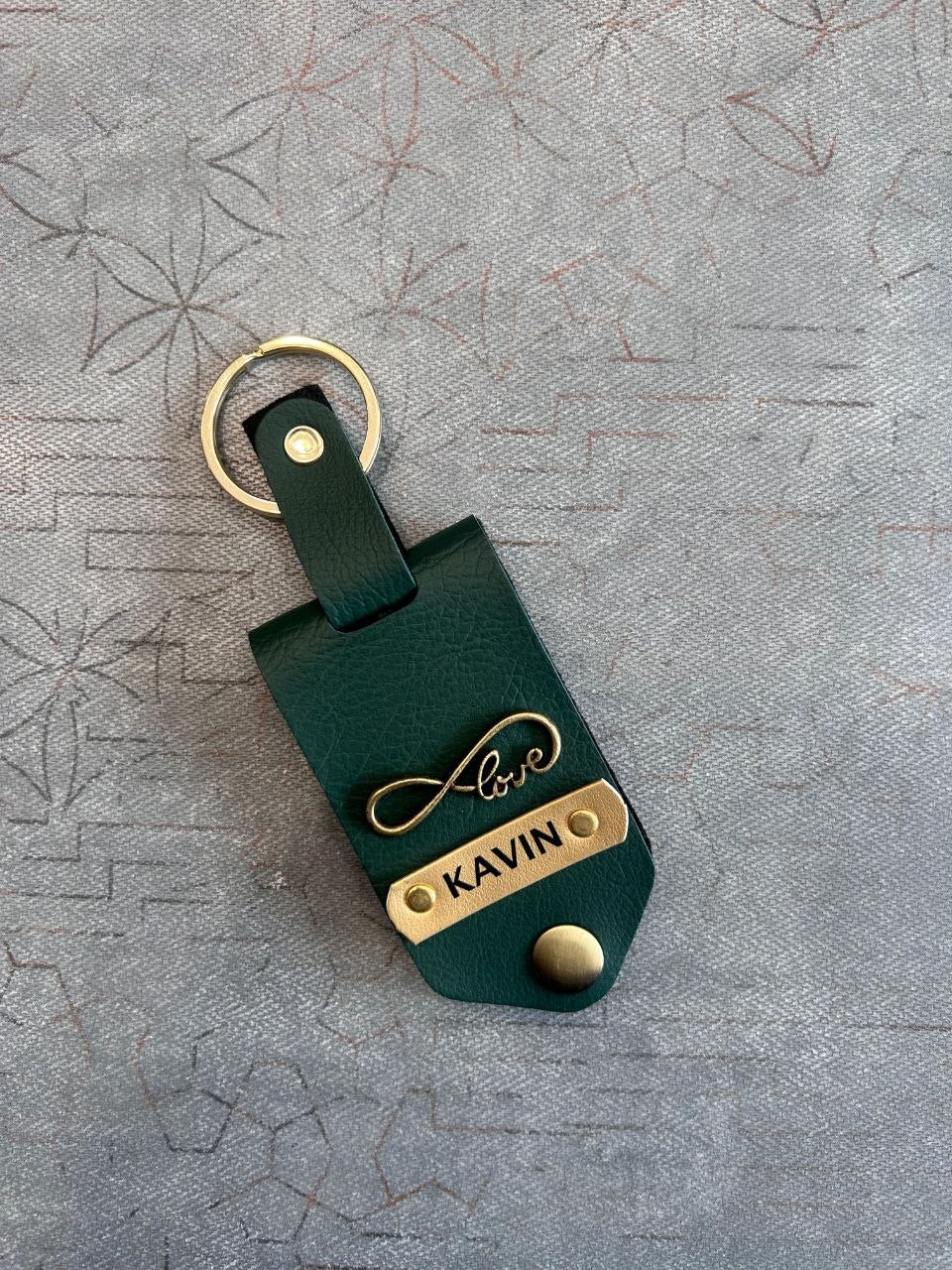 premium leather keychain gold metal name plate close up texture personalized keyring | Zestpics