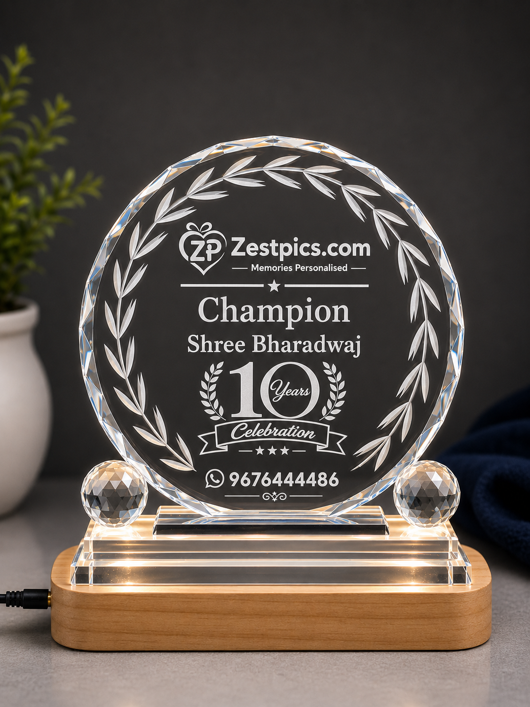 Personalised 10 Years Champion crystal trophy with Shree Bharadwaj name and illuminated wooden base