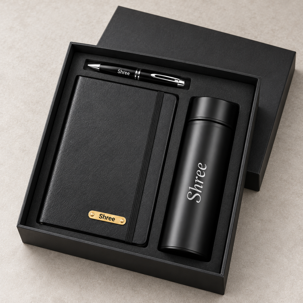Angled view of personalised black diary bottle and pen gift set in fitted gift box