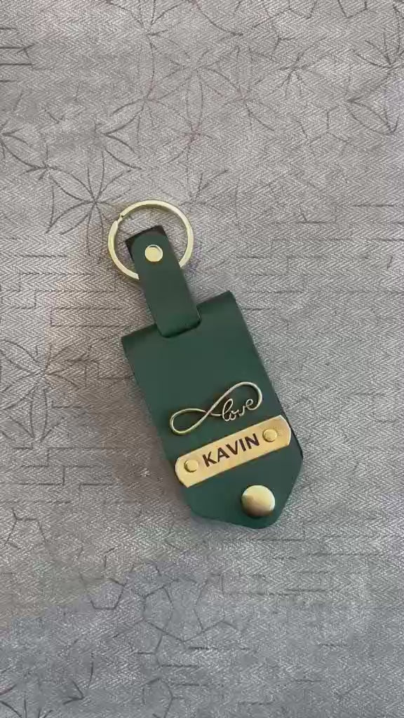 premium leather keychain gold metal name plate close up texture personalized keyring | Zestpics